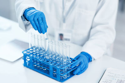 Midsection of scientist working in clinic