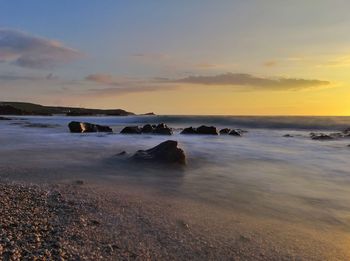 Scenic view of sea against sky during sunset