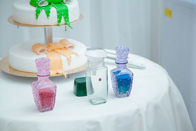 Wedding cake and objects on table