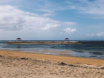 Scenic view of beach against sky