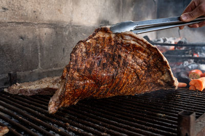 High angle view of meat on barbecue grill