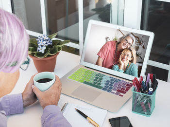 Group of people using laptop on table