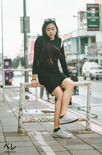 Portrait of beautiful woman in city