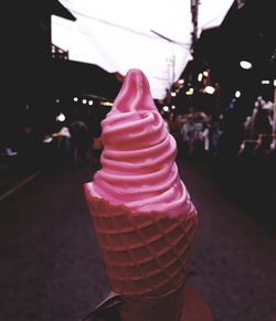 Close-up of ice cream cone on street
