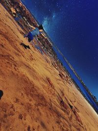 Scenic view of beach against blue sky