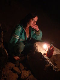 Woman standing at night
