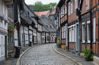 Footpath amidst buildings in town