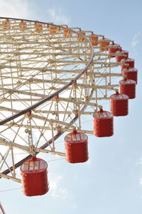 Low angle view of ferris wheel against sky