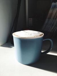 Close-up of cappuccino on table