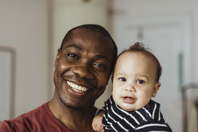 Portrait of happy mother with baby