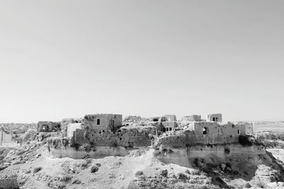 Old buildings against clear sky