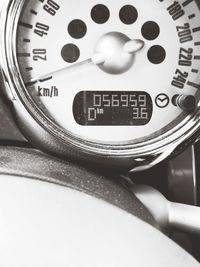 Close-up of clock in car