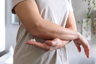 Midsection of man holding hands