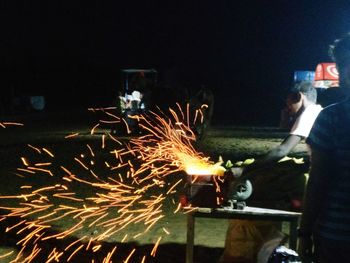 Man working in factory at night
