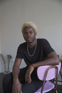 A young man sitting down