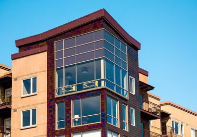 Low angle view of building against blue sky