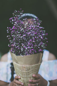 Midsection of woman holding ice cream