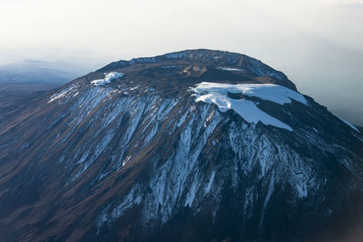 Scenic view of snowcapped mt. kilimanjaro, tanzania from the air.