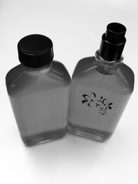 High angle view of wine bottles against white background