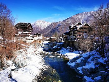 Scenic view of snow covered mountains against sky