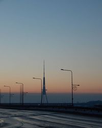 View of electricity pylon at sunset