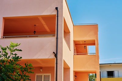 Low angle view of building against clear blue sky