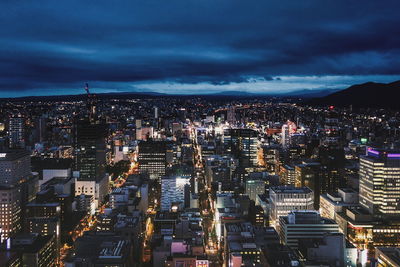 Aerial view of city lit up at night