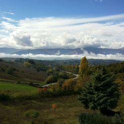 Scenic view of landscape against cloudy sky