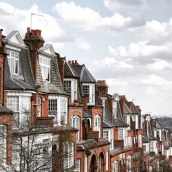 View of buildings against cloudy sky