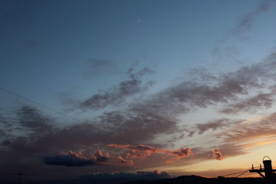 Low angle view of dramatic sky during sunset