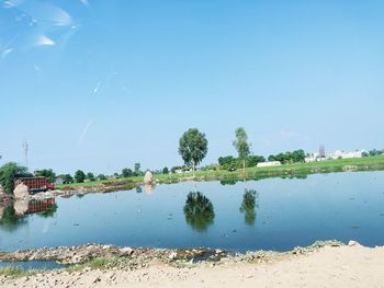 Scenic view of sea against clear blue sky
