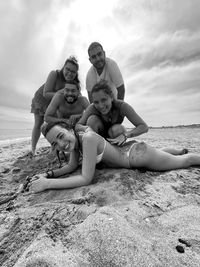 High angle view of girls on beach against sky