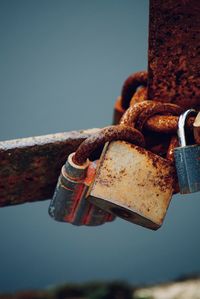 Close-up of padlocks on rusty metal