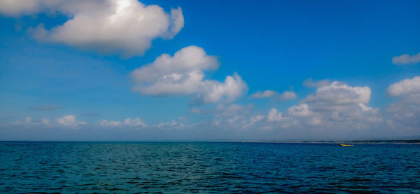 Scenic view of sea against blue sky