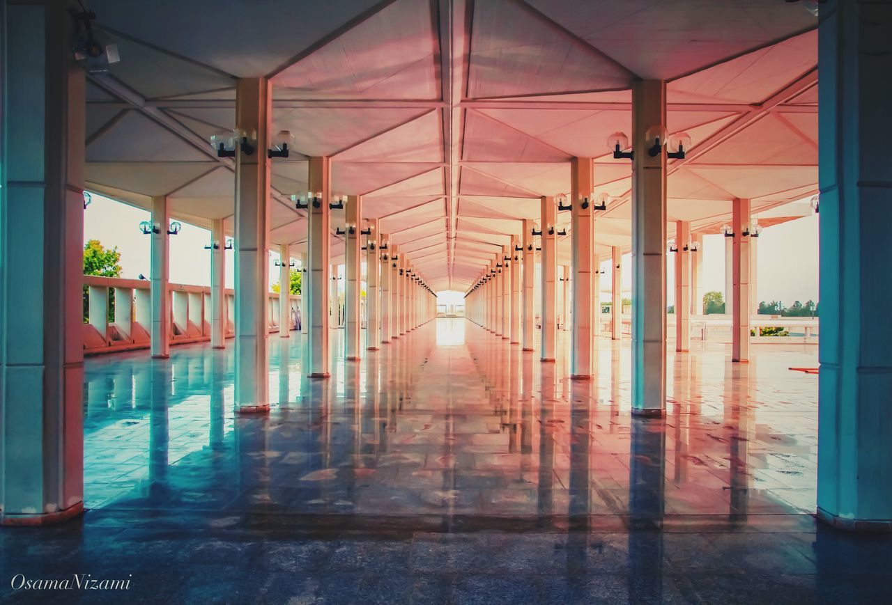 VIEW OF EMPTY CORRIDOR WITH BUILDING