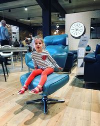 Portrait of woman sitting on chair