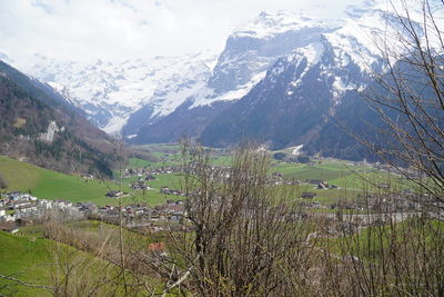 Scenic view of snowcapped mountains against sky