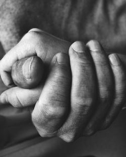 Close-up of person holding hands