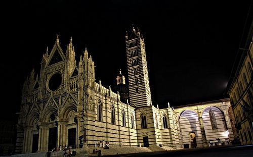 Low angle view of illuminated temple against sky at night