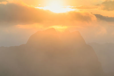 Scenic view of mountains against sky during sunset