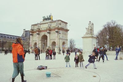 Group of people in front of historical building