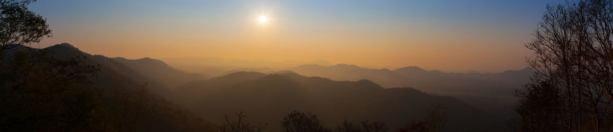 Scenic view of mountains against sky during sunset