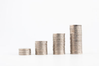 Stack of coin against white background