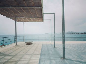 Scenic view of sea against sky in city