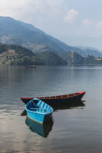 Boat in lake against sky