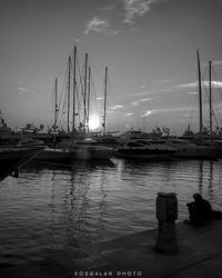 View of harbor at sunset