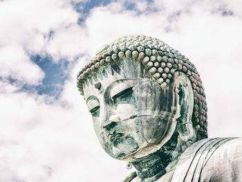 Low angle view of statue against sky