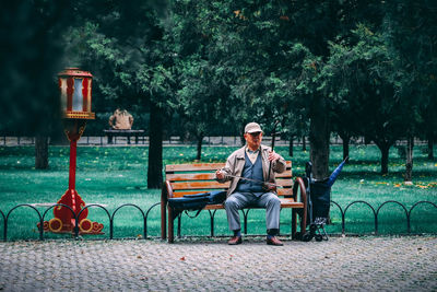Portrait of man sitting in park
