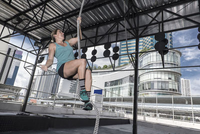 Woman training at rooftop gym in bangkok