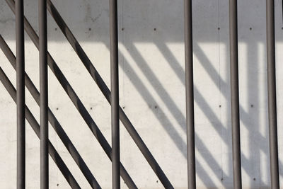 Patterned metal against concrete wall